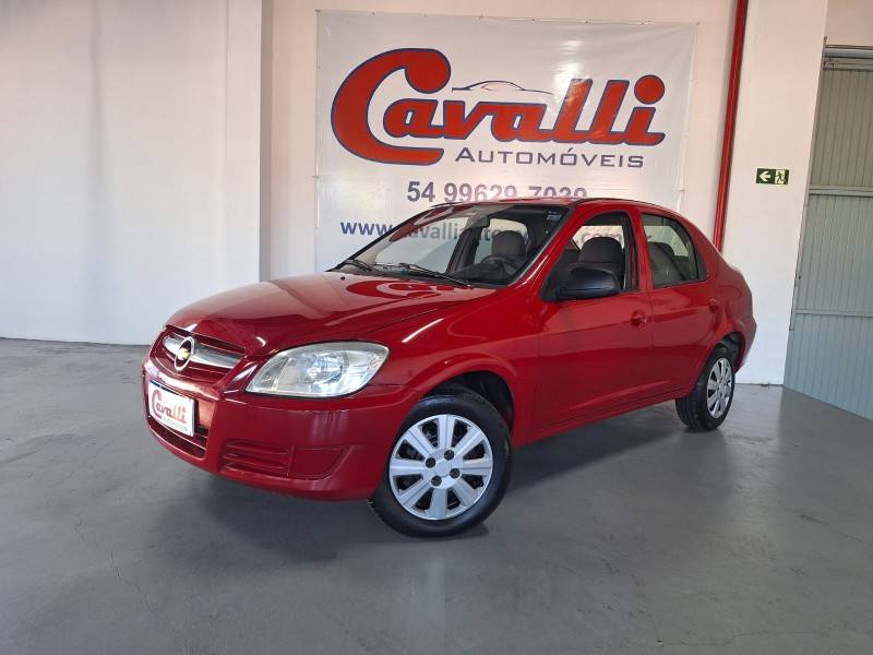 CHEVROLET - PRISMA - 2010/2011 - Vermelha - R$ 30.900,00