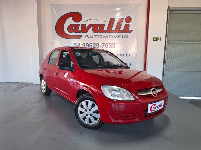 CHEVROLET - PRISMA - 2010/2011 - Vermelha - R$ 30.900,00